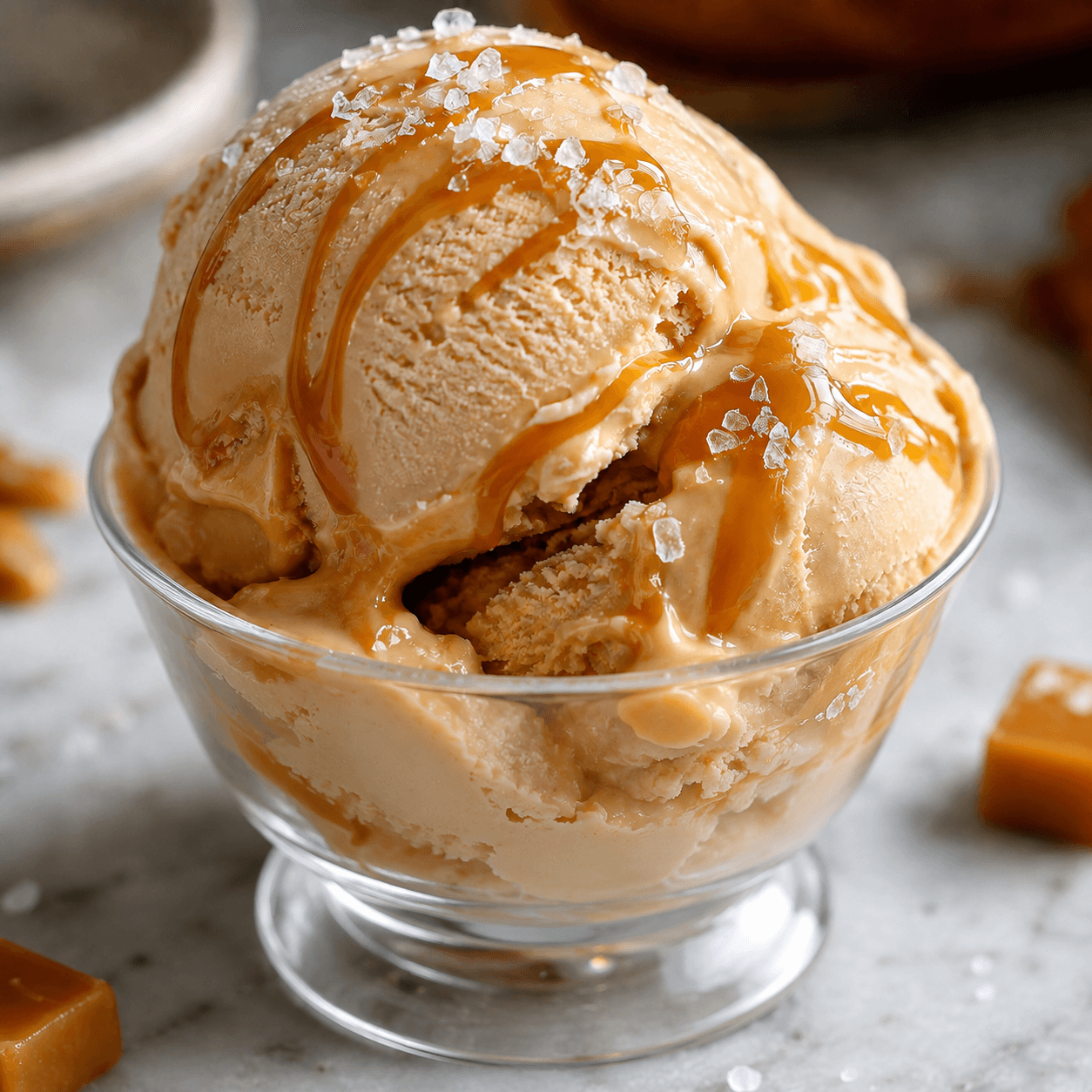 Scoops of Italian gelato in a bowl with a sunny backdrop.