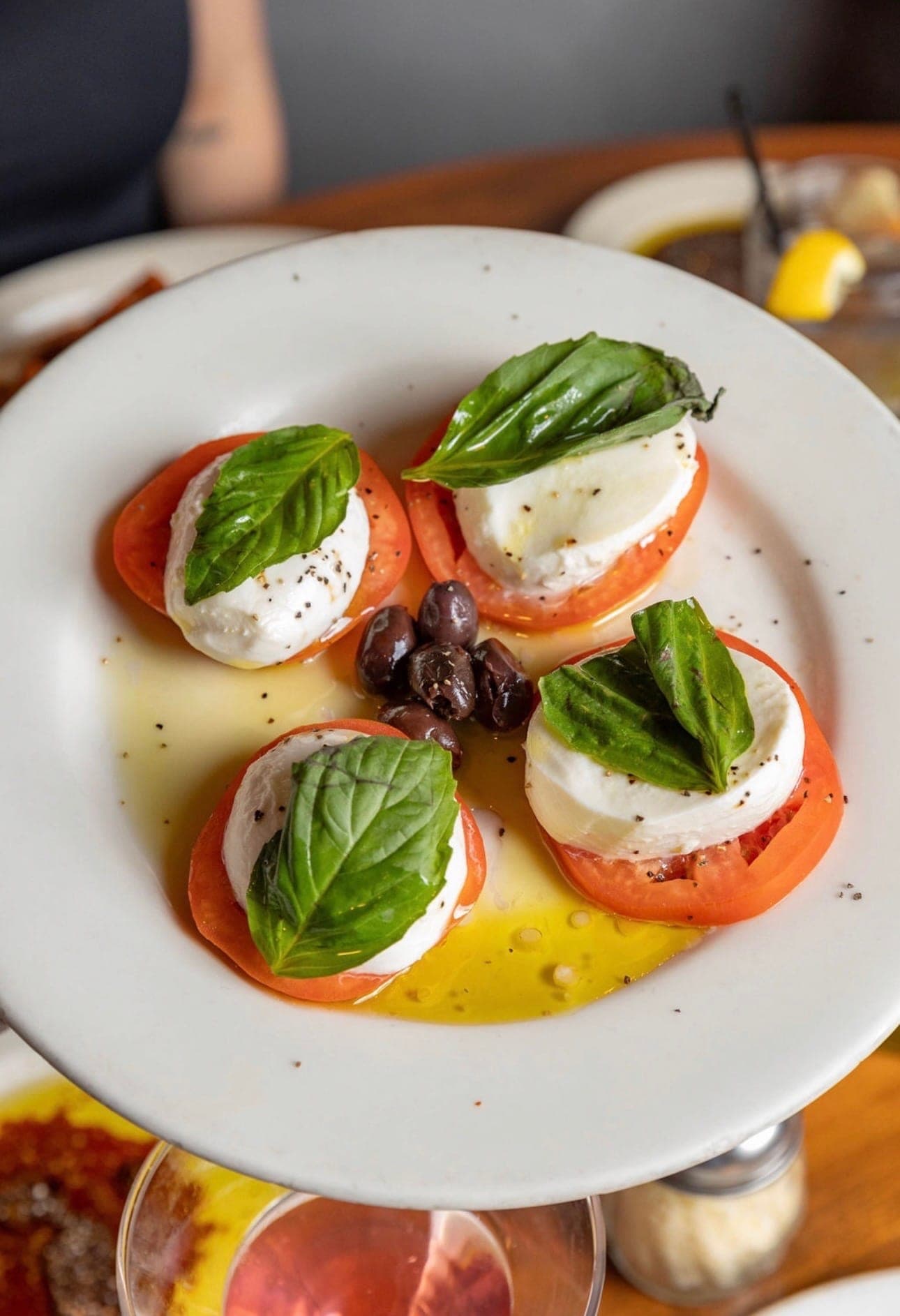 Caprese with buffalo mozzarella and fresh basil for catering trays.